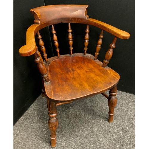 1615 - A Victorian beech and elm smoker’s bow elbow chair, 81cm high, 65cm wide, the seat 44cm deep