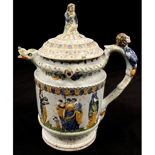 1239 - A unusual 18th century pratware pearlware puzzle jug, moulded in relief decoration, in the typical y... 