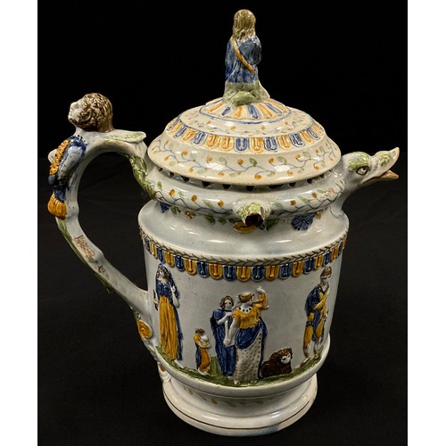 1239 - A unusual 18th century pratware pearlware puzzle jug, moulded in relief decoration, in the typical y... 