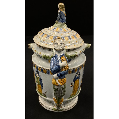 1239 - A unusual 18th century pratware pearlware puzzle jug, moulded in relief decoration, in the typical y... 