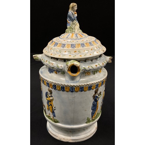 1239 - A unusual 18th century pratware pearlware puzzle jug, moulded in relief decoration, in the typical y... 