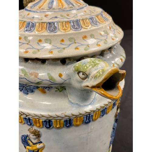 1239 - A unusual 18th century pratware pearlware puzzle jug, moulded in relief decoration, in the typical y... 