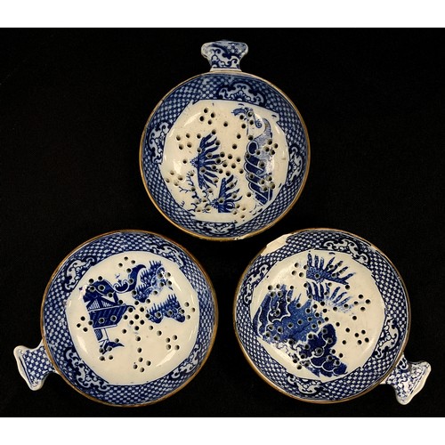 1204 - A group of three 19th century pearlware Milsey strainers, blue transfer print, 9cm diameter, c.1820 ... 