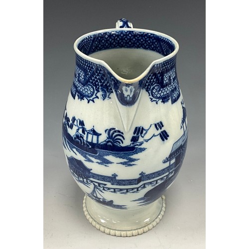 1187 - A 19th century pearlware blue and white transfer-printed pitcher, decorated with a Boy on a Buffalo,... 