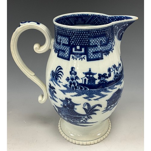 1187 - A 19th century pearlware blue and white transfer-printed pitcher, decorated with a Boy on a Buffalo,... 