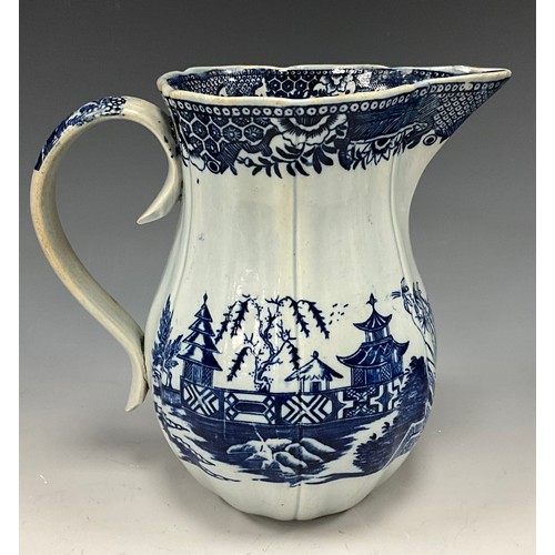 1187 - A 19th century pearlware blue and white transfer-printed pitcher, decorated with a Boy on a Buffalo,... 