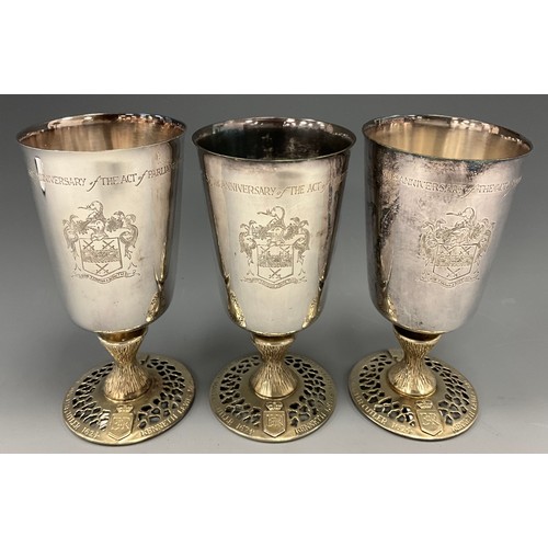 406 - A set of three Elizabeth II silver goblets, commemorating the 350th Anniversary of the Act of Parlia... 