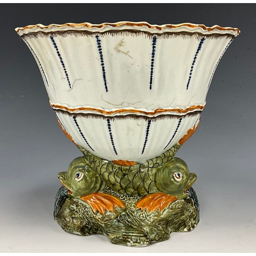 1226 - A Pratware pearlware oval vessel, moulded body of intertwined fish on textured base, in the typical ... 