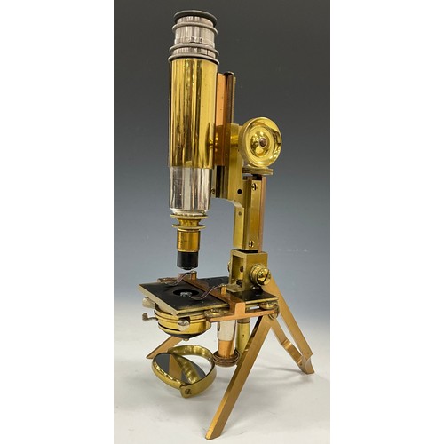 2078 - An early 20th Century brass monocular microscope by J Swift and Son London No 624, single lens on fo... 