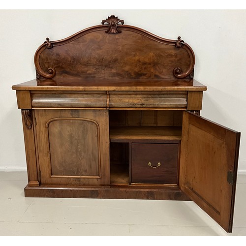 1577 - An early Victorian mahogany chiffonier, shaped quarter galleried back, with carved crest, and C-scro... 