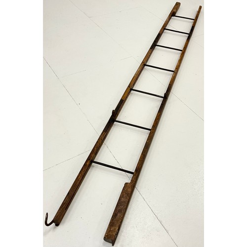 1878A - A WWI folding trench ladder, elm and cast iron construction, folding into three main sections, with ... 