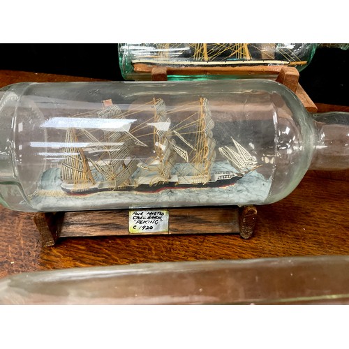 2153 - Maritime Interest - early 20th century hand crafted ships in bottles including a four masted steel b... 