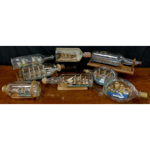 2155 - Maritime Interest - early 20th century hand crafted ships in bottles including Quito, 30cm long; oth... 