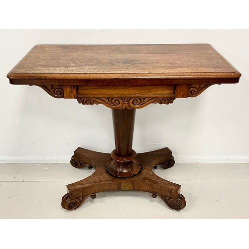 1797 - A William IV rosewood card table, carved frieze, tapering cylindrical support with carved lotus to b... 