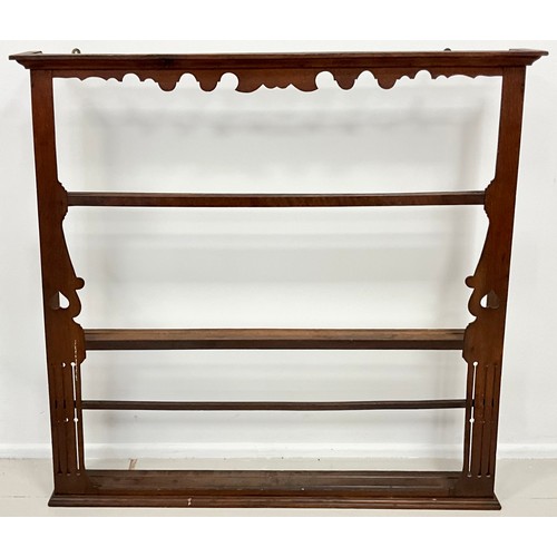 1675 - A George III oak wall mounted three tier plate rack, shaped frieze, shaped and pierced sides, approx... 