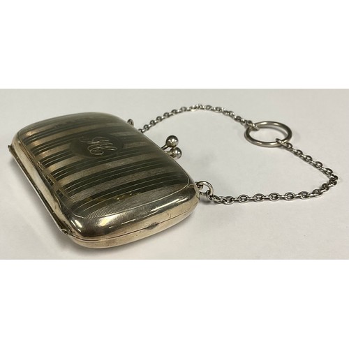 66 - A George V silver rounded rectangular evening purse, 8cm wide, Birmingham 1915, 56g gross