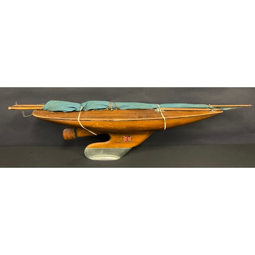 590 - A mid century softwood scratch built pond yacht, reg. 771594, with lead keel, 78cm long, weighted ba... 