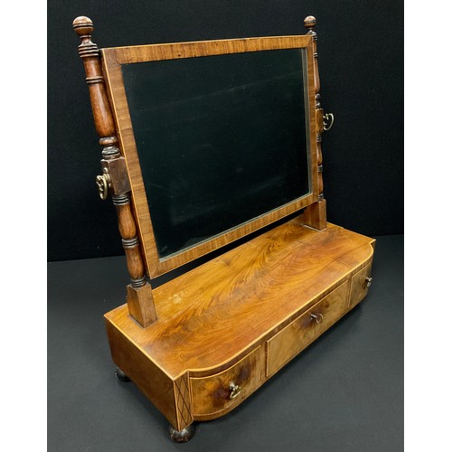 1689A - A George III walnut and mahogany table top toilet mirror, the mirror tilting on turned supports, ove... 