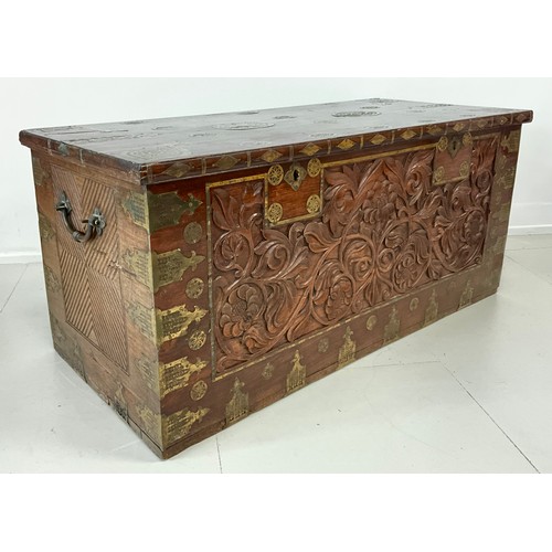 1629A - A late 19th / early 20th century Indo-European carved secure chest, ornate brass inlay, the front ca... 