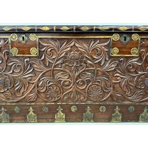 1629A - A late 19th / early 20th century Indo-European carved secure chest, ornate brass inlay, the front ca... 