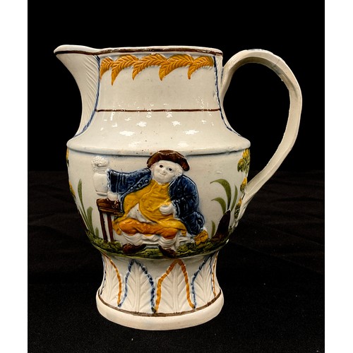 1226A - A 19th century pearl ware Prattware jug, moulded in relief decoration of gentleman with his ale, 14c... 