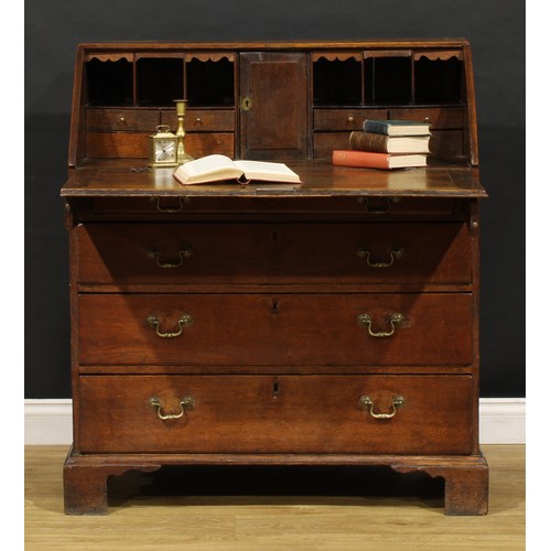 2159 - A George III oak bureau, fall front enclosing a fitted interior above four long graduated drawers, b... 