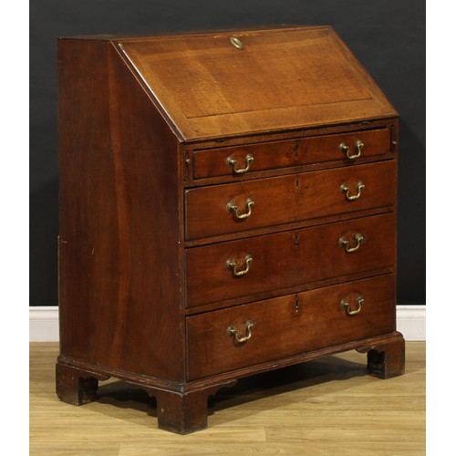 2159 - A George III oak bureau, fall front enclosing a fitted interior above four long graduated drawers, b... 