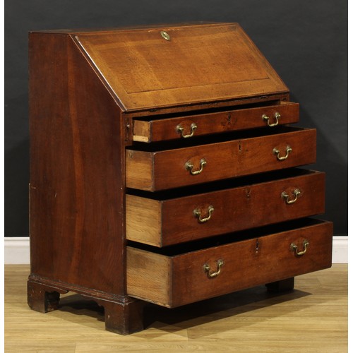 2159 - A George III oak bureau, fall front enclosing a fitted interior above four long graduated drawers, b... 