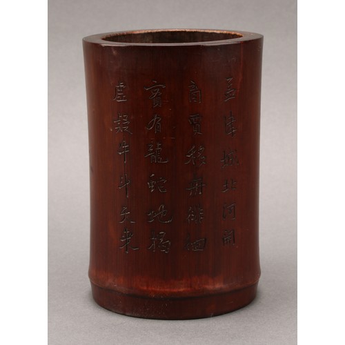 1396A - A Chinese bamboo scholar's bitong brush pot, carved in relief with an elder, inscribed to verso, 14.... 