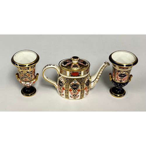 20 - A Royal Crown Derby 1128 Imari pattern miniature teapot, 7.5cm high, second quality; a 1128 pattern ... 