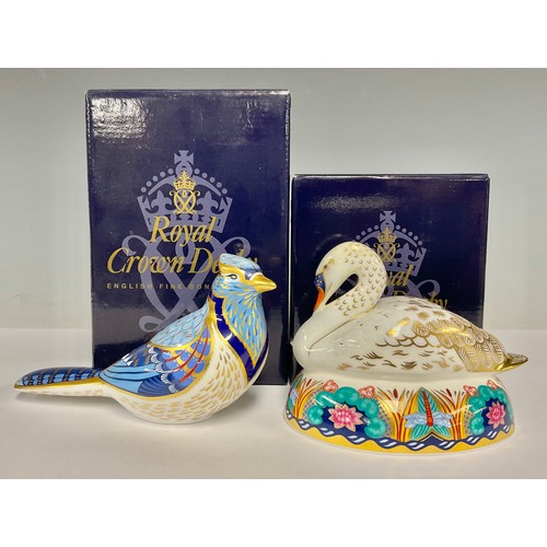 23 - A Royal Crown Derby paperweight, Blue Jay, gold stopper, boxed; another, Swan, gold stopper, boxed (... 