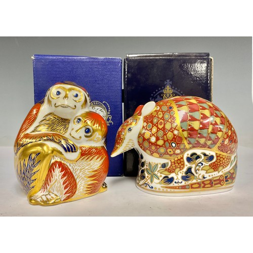 55 - A Royal Crown Derby paperweight, Armadillo, gold stopper, boxed; another, Monkey and Baby, gold stop... 