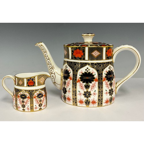 63 - A Royal Crown Derby 1128 Imari pattern teapot and cover, 16cm high, first quality; an 1128 pattern c... 