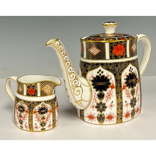 63 - A Royal Crown Derby 1128 Imari pattern teapot and cover, 16cm high, first quality; an 1128 pattern c... 