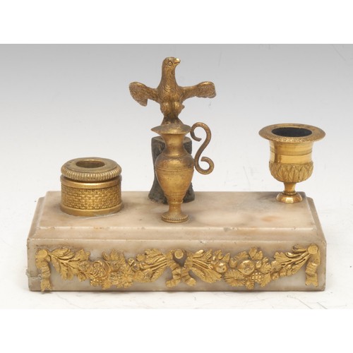 79 - A French Empire style inkstand, central bronze eagle flanked by campana and basket shaped ormulu ink... 