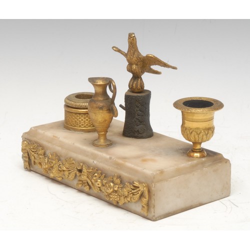 79 - A French Empire style inkstand, central bronze eagle flanked by campana and basket shaped ormulu ink... 