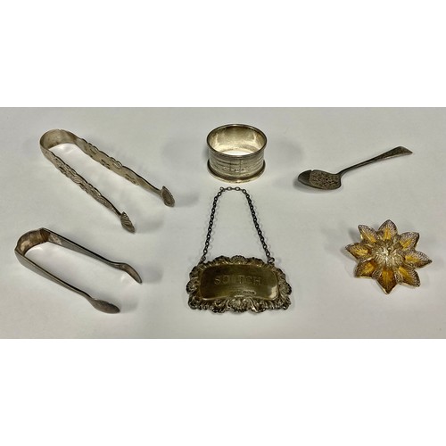 92 - A pair of George III silver sugar tongs, pierced tines, shell tips, probably  Thomas Wallis I, Londo... 