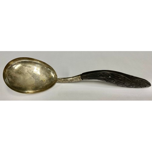 152 - A modern Sri Lankan silver coloured metal and carved coconut shell rise or serving spoon, unmarked 2... 