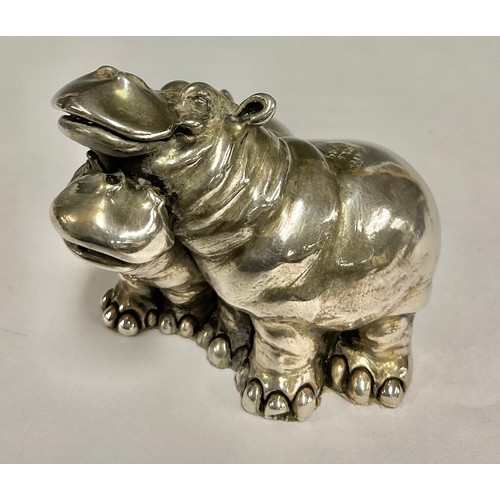 157 - A Continental silver model, of a pair of characterised hippos, 5.5cm high, marked high, 121g gross