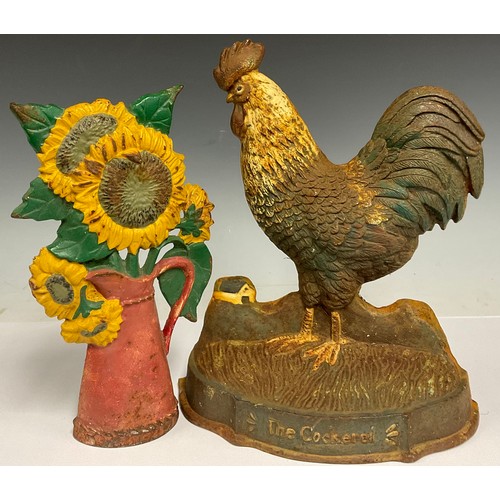 192 - A cast iron doorstop, as a cockerel; another as a jug of flowers