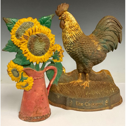 192 - A cast iron doorstop, as a cockerel; another as a jug of flowers