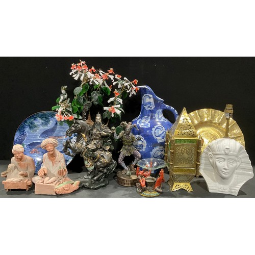 229 - A North African brass lantern; a pair of North African terracotta figure, of market sellers; an Orie... 