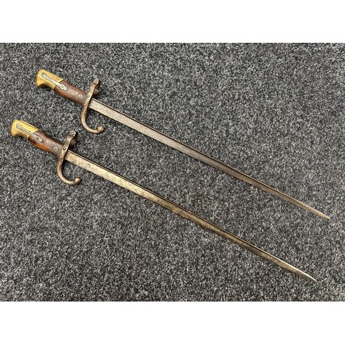 3114 - Pair of French MLE 74 Gras Bayonets, both without scabbards. One dated 1875 and the other 1876. Both... 