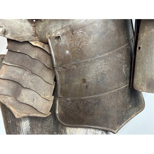 3115 - A Victorian Era Replica Suit of Armour. Constructed from thin sheet steel with some etched decoratio... 