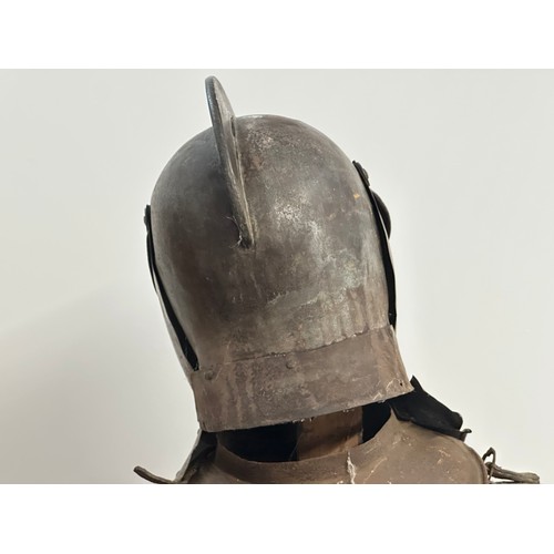 3115 - A Victorian Era Replica Suit of Armour. Constructed from thin sheet steel with some etched decoratio... 