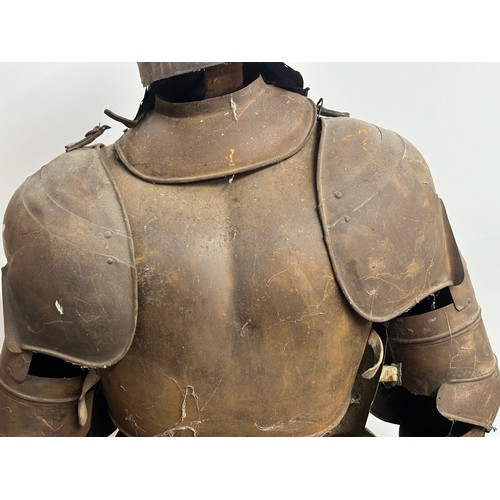 3115 - A Victorian Era Replica Suit of Armour. Constructed from thin sheet steel with some etched decoratio... 