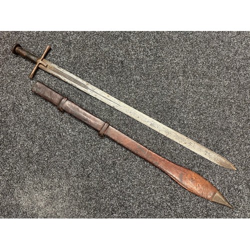 3117 - Sudanese Kaskara Sword with double edged fullered blade 935mm in length. Steel crossguard and leathe... 