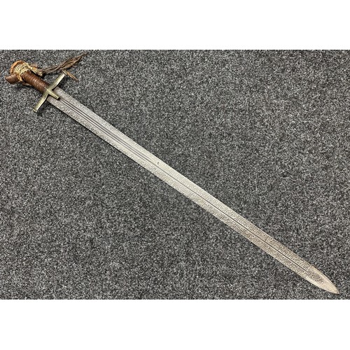 3118 - Sudanese Kaskara Sword with double edged fullered patterned blade 950mm in length. Brass crossguard.... 