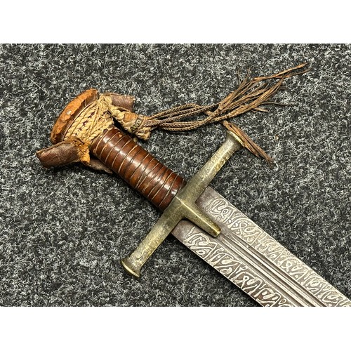 3118 - Sudanese Kaskara Sword with double edged fullered patterned blade 950mm in length. Brass crossguard.... 