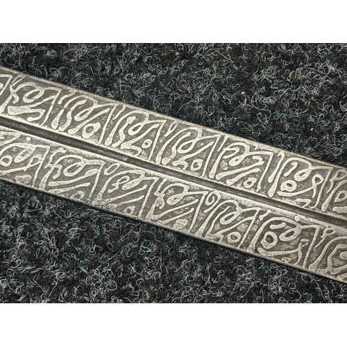 3118 - Sudanese Kaskara Sword with double edged fullered patterned blade 950mm in length. Brass crossguard.... 